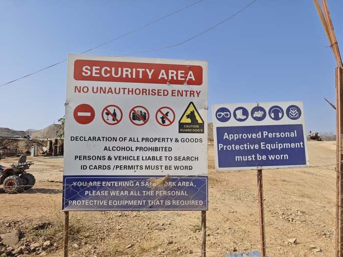 Site safety and PPE signage at the entrance